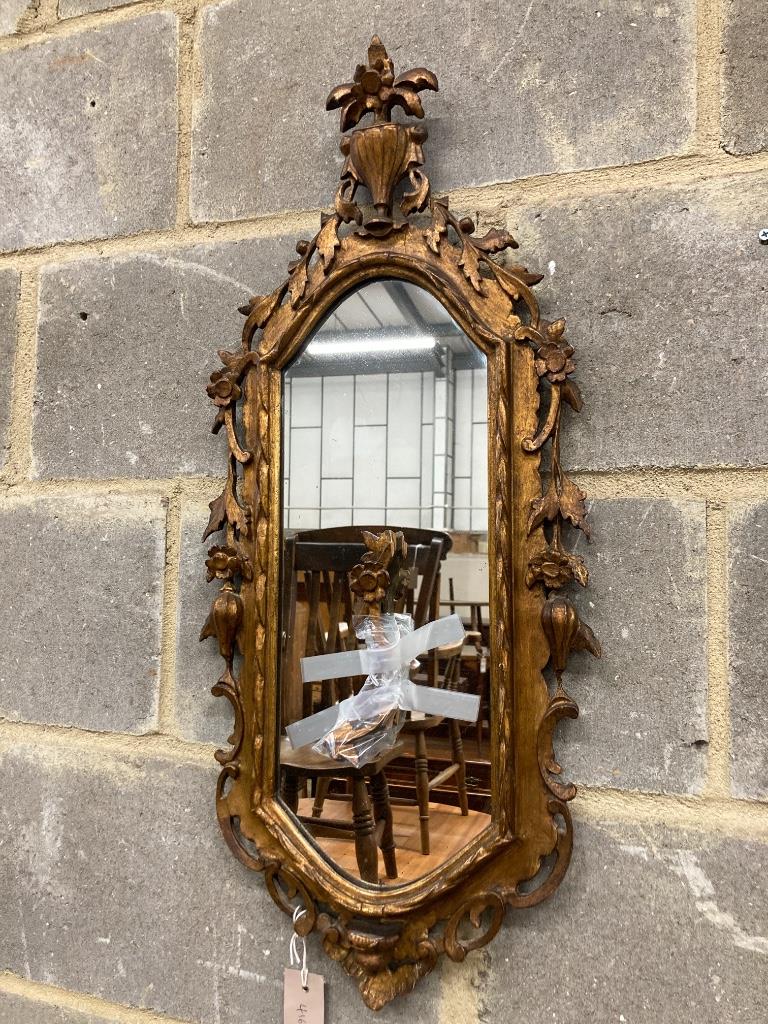 A pair of carved giltwood wall mirrors, width 30cm, height 74cm